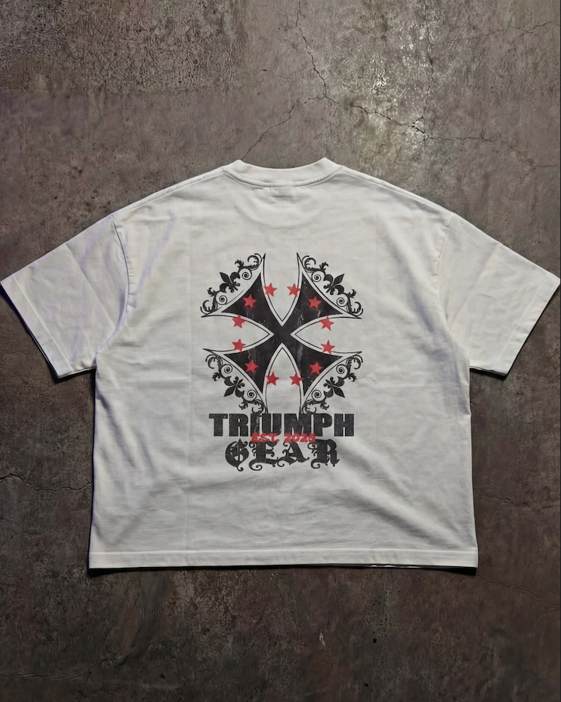 White t-shirt with black and red graphic design on a textured surface