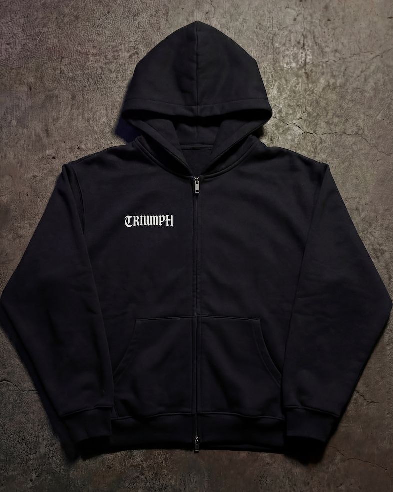 Black hoodie with a brand logo on a textured surface