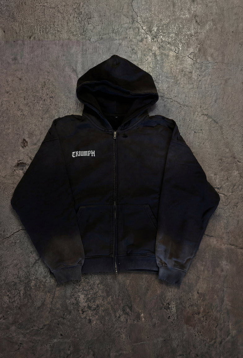Black hoodie with a brand logo on a textured gray surface